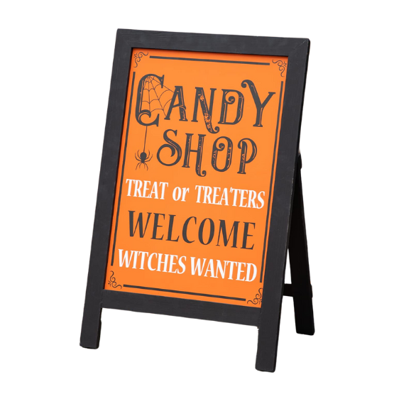 Halloween sign with words 'Candy shop, treat or treaters welcome, witches wanted'