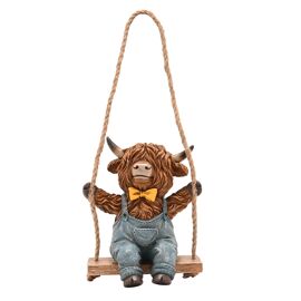 Country Living Highland Cow On A Swing