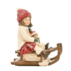 Victorian Girl On Sledge Figurine